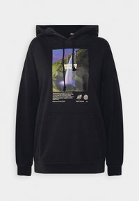 Felpa nera con cappuccio e grande stampa grafica di una cascata e testo sul davanti. Presenta lacci e una tasca a marsupio.