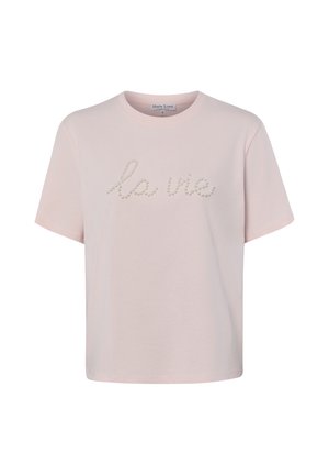 Hellrosa T-Shirt mit kurzen Ärmeln und rundem Ausschnitt mit Perlenverzierung, die vorne "la vie" buchstabiert.