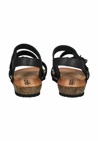 Black leather sandals featuring multiple straps, cork footbed, and rubber sole. Designed with a backless style for easy wear.