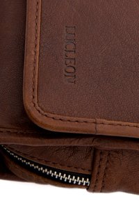 Brown leather wallet with a textured finish, featuring embossed logo and stitched edges. Includes a zippered pocket and smooth clasp closure.