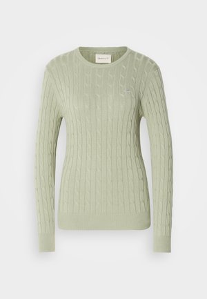 Heled roheline kabeliga kudum, ümmarguse kaelusega, pikkade varrukatega ja soonikkoes mansettidega. Rinnal on väike logo.