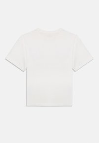 T-shirt en coton blanc à manches courtes avec un col rond, présentant un design simple et sans embellissement, avec une coupe droite.
