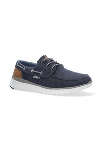 Marineblaue Segelschuhe aus Canvas mit hellbraunen Lederdetails, weiße Gummisohle, Schnürdesign und Kontraststickerei auf dem Obermaterial.