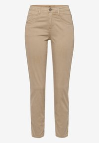 Beige cotton chinos with a slim straight fit, featuring front pockets and a single-button closure. Smooth texture, minimal stitching detail.