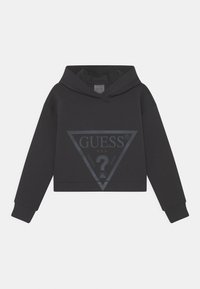 Sudadera negra recortada con mangas largas y un gran logo triangular de Guess en gris oscuro en el frente.