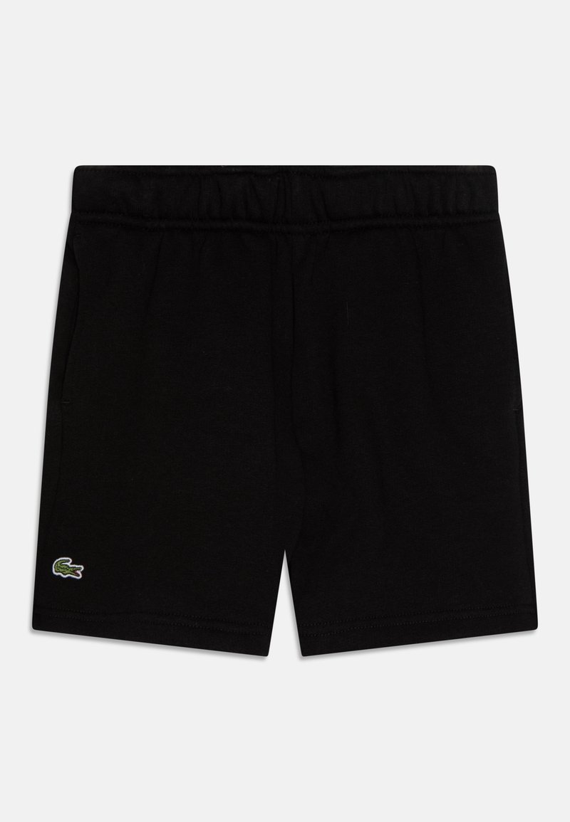 Shorts noirs à taille élastique avec un petit logo crocodile Lacoste vert sur la partie inférieure gauche de la jambe sur fond blanc.