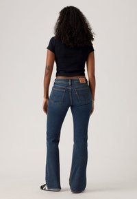 Levi's® SUPERLOW BOOTCUT - Jeans bootcut - sweep down