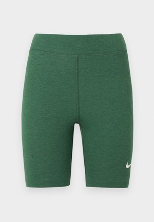 Calções desportivos verdes feitos de tecido elástico. Design de cintura alta com costuras planas e um logótipo branco da Nike na parte inferior da perna esquerda.