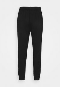 Schwarze Jogginghose aus weichem Stoff, mit einem elastischen Bund und schmalen Bündchen an den Knöcheln. Glatte Textur, einfaches Design.