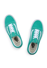 Teal suede Vans sneakers with white laces, side stripes, and a contrasting red heel accent. Classic design with rubber soles and padded collars.