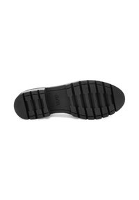 Semelle de chaussure en caoutchouc noir avec des rainures profondes pour une meilleure adhérence et le nom de la marque "ara" embossé au centre.