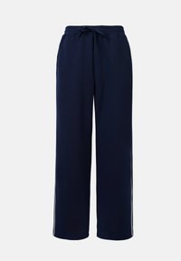 Pantalons amples bleu marine en tissu doux, dotés d'une taille élastiquée avec cordon de serrage et de rayures blanches contrastantes sur les côtés. Texture lisse et coupe décontractée.
