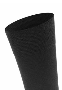 Calzino in cotone nero con un polsino a coste testurizzato e corpo liscio, dotato di un design senza cuciture per comfort e vestibilità.