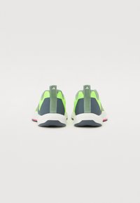 Neon green and navy training shoes with a textured mesh upper, white midsole, and pink outsole accents. Features pull tabs for easy wear.