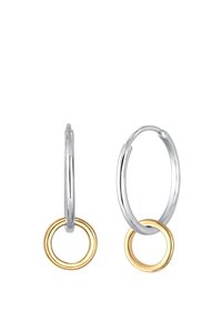 Boucles d'oreilles en argent avec des anneaux intérieurs en or. Fini lisse et poli ; deux tailles ; design circulaire avec une texture douce.