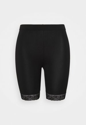 Cuissards de cyclisme noirs longueur genou avec taille élastique et bordure en dentelle aux ouvertures des jambes, présentés sur un fond uni.