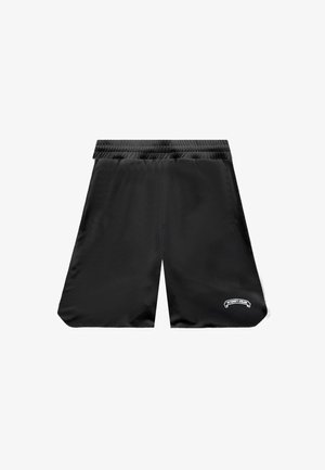 Shorts de sport noirs avec taille élastique, poches latérales et petit patch logo blanc sur la partie inférieure de la jambe gauche.