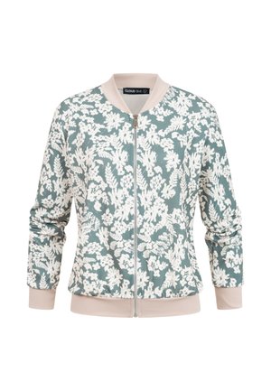 Veste bomber zippée avec col et poignets rose pâle, présentant des motifs floraux blancs sur un fond vert doux.