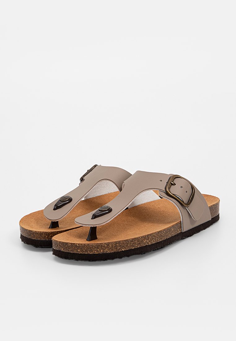 Sandales en liège marron avec des brides synthétiques beiges, design à l'orteil, boucle ajustable et semelle texturée. Surface lisse avec des accents noirs.