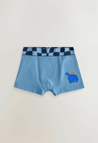 Zili kokvilnas bokseri ar zilu ķekaru jostu, kurā ir dinozaura grafika un saules detaļa kreisajā augšstilbā.
