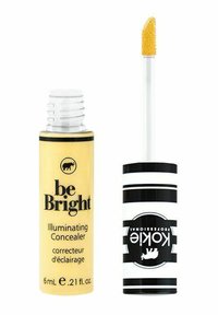 Gul cylindrisk behållare med texten "be Bright Illuminating Concealer", med ett svart och vitt randigt lock och en spetsig applicator.