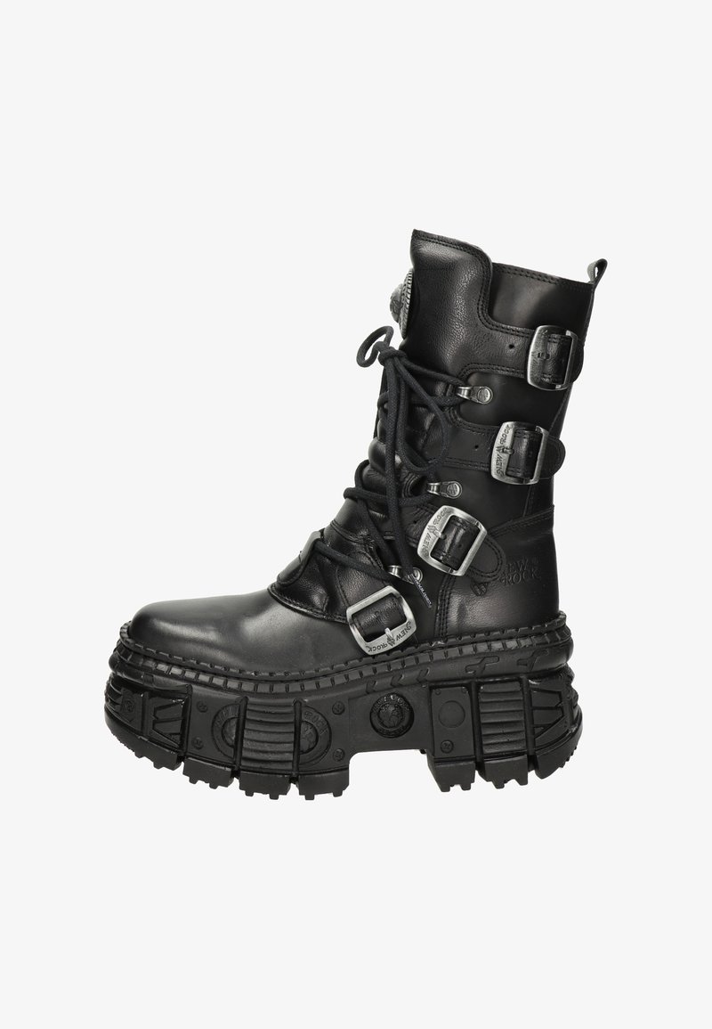 Black leather combat boot featuring multiple silver buckles, thick rubber sole with textured tread, and front lace-up design.