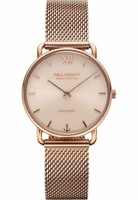 Roségoldene Uhr mit einem runden, minimalistischen Zifferblatt und Mesh-Armband. Verfügt über dünne Stundenmarkierungen und "PAUL HEWITT" auf dem Zifferblatt eingraviert. Solarbewegung.