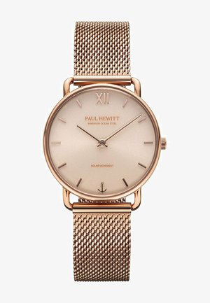 Roségoldene Uhr mit einem runden, minimalistischen Zifferblatt und Mesh-Armband. Verfügt über dünne Stundenmarkierungen und "PAUL HEWITT" auf dem Zifferblatt eingraviert. Solarbewegung.