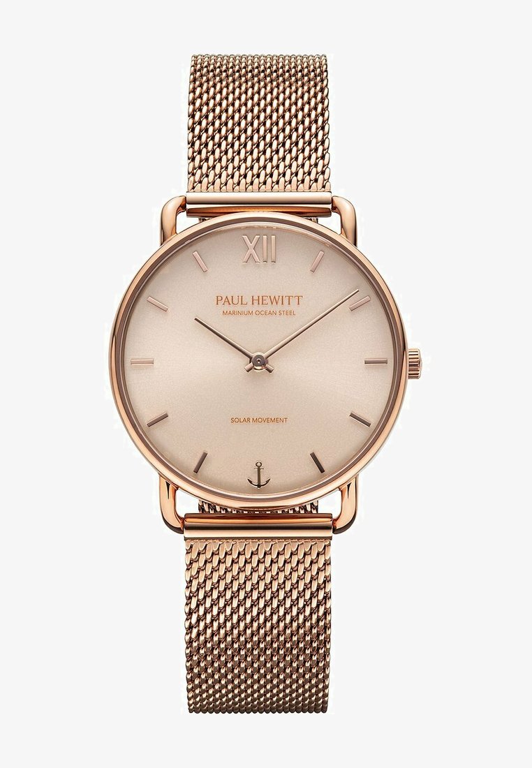Orologio in oro rosa con quadrante rotondo e minimalista e bracciale a rete. Presenta indicatori delle ore sottili e la scritta "PAUL HEWITT" incisa sul quadrante. Movimento solare.