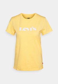 Camiseta de algodón amarilla con cuello redondo clásico y mangas cortas, con un logo blanco de Levi's centrado en la parte delantera.