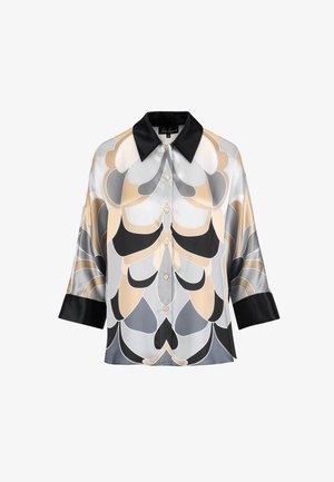 Krekls ar pogām un melnu apkakli, ar ģeometrisku rakstu pelēku, bēšu un melnu toņu krāsās. Izgatavots no gludas auduma, ar elkškrānu piedurknēm.