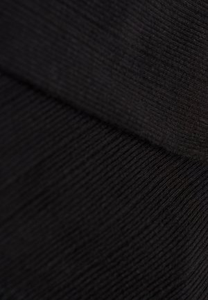 Tissu en tricot noir avec une texture côtelée, comportant deux sections superposées. Le matériau semble doux et légèrement extensible.