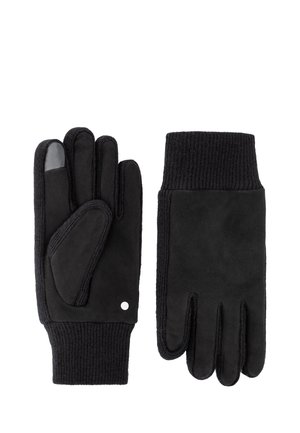 Pair of black gloves with knit cuffs, one showing palm side with touchscreen-compatible tip on index finger.