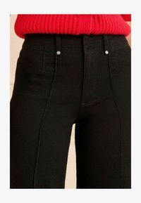 Wybrany, black