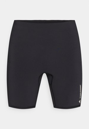 Shorts de bain noirs en tissu extensible. Présentent une coupe ajustée, une entrejambe courte et une ceinture renforcée avec de petites poches latérales.