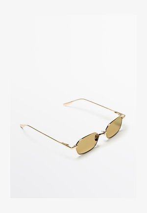 Goldene Sonnenbrille mit ovalen Gläsern in einem hellbraunen Farbton. Dünner, eleganter Rahmen und Arme mit minimalistischem Design und ohne auffällige Muster.