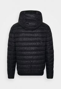Black puffer jacket with a hood, featuring a sleek quilted design and tonal logo pattern. Elastic cuffs and hem provide a snug fit.