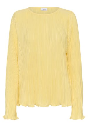 Kortselt kollane topp pikkade varrukatega, ümmarguse kaelusega, voolava silueti ja lainelise äärega. Valmistatud kerge kangaga, millel on tekstuuriline pind.