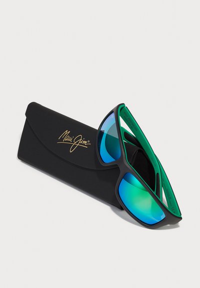 Black Maui Jim sunglasses with reflective blue-green lenses, housed in a black case featuring the brand's gold logo.