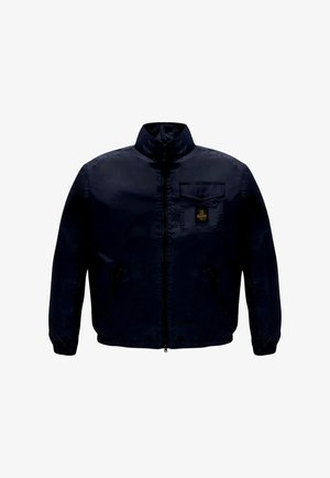 Navyblauw jack met rits, hoge kraag, borstzak met knoop en elastische manchetten en zoom.