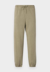 Olivengrønne sweatpants med elastisk taljebånd, justerbar snor og smalle manchetter. Blød tekstur med en glat finish.