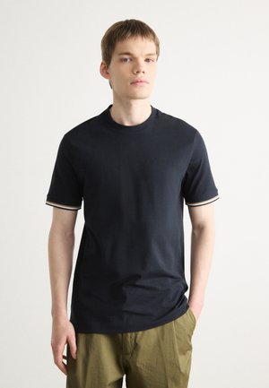 Navy blue short-sleeve T-shirt made of cotton with contrasting striped accents on sleeves. Round neck and a relaxed fit.