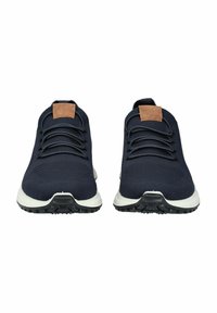 Navy athletic shoes with a textured knit upper, lace-up design, brown leather accents on the heel, and a white and black rubber sole.