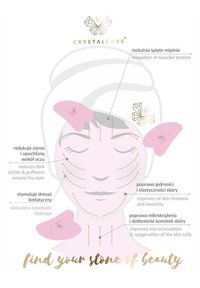 Różowe narzędzie do masażu twarzy przedstawione na diagramie twarzy, podkreślające korzyści złotym tekstem. Prosty design, gładka faktura i delikatne kolory.