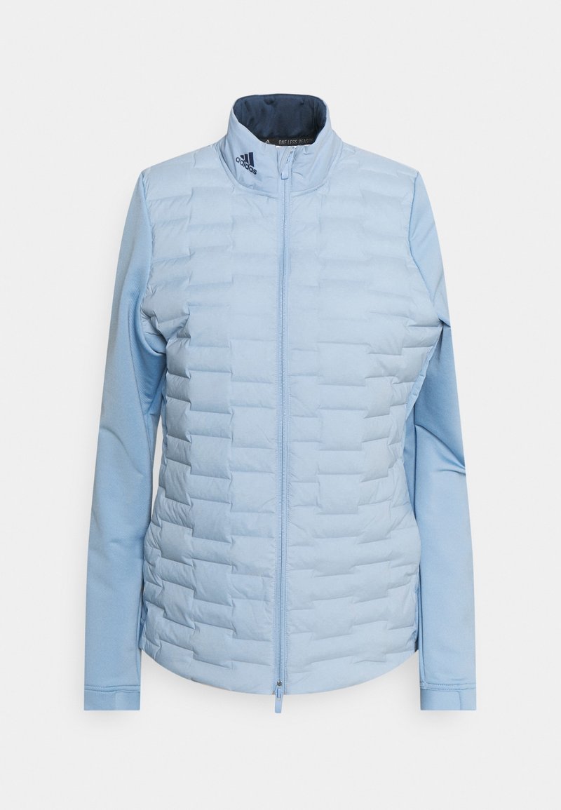 Vaaleansininen eristettävä takki, jossa on vetoketjukiinnitys, päällä kuvioitu muotoilu ja sileät hihat. Kauluksessa on Adidas-logo.