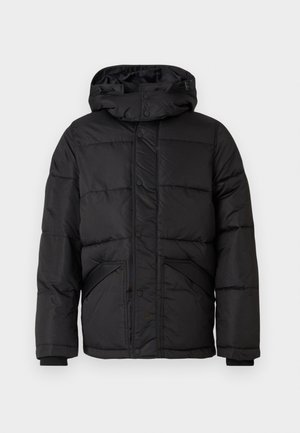 Doudoune noire avec capuche, avec un design matelassé, des fermetures à boutons-pression et des poignets côtelés. Deux poches latérales.