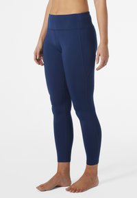 Navy blauwe leggings gemaakt van rekbare stof, met een hoge tailleband, een aansluitende pasvorm en platte naden voor comfort en ondersteuning.