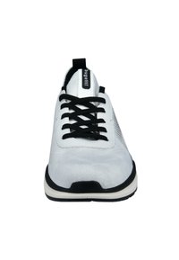White sneaker with black laces and a textured upper. Features a black rubber sole and mesh side panels for breathability.