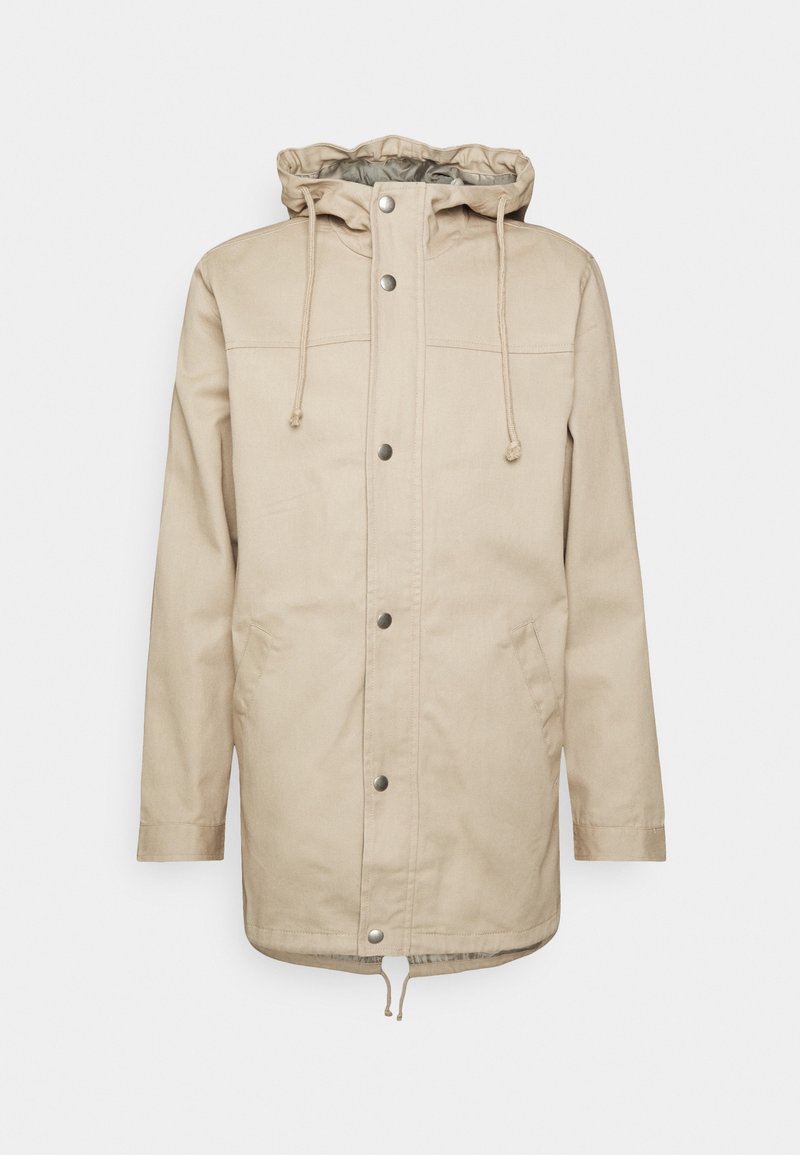 Giacca beige con cappuccio, bottoni automatici, cordino regolabile, due tasche laterali e orlo leggermente curvo. Realizzata in tessuto resistente.