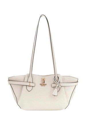 Sac cabas synthétique blanc avec bordure noire, doubles poignées et ferrures dorées. Présente une forme structurée et un détail de pompon attaché.